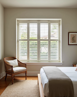 Tier on tier plantation shutter in bedroom